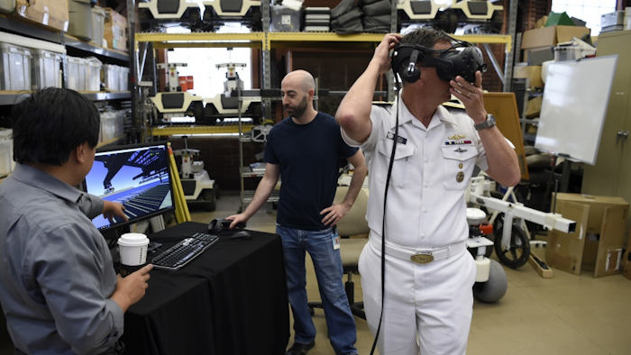 Rear Adm. David Hahn, chief of naval research, tours the National Robotics Engineering Center (NREC) during a visit to Carnegie Mellon University (CMU) in Pittsburgh, Pa.