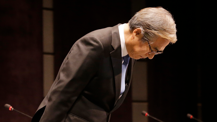 BMW Korea Chairman Kim Hyo-joon bows during a press conference in Seoul, South Korea, Monday, Aug. 6, 2018.