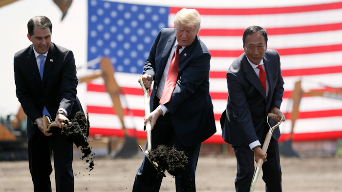 In this June 28, 2018, file photo, President Donald Trump, center, along with Wisconsin Gov. Scott Walker, left, and Foxconn Chairman Terry Gou participate in a groundbreaking event for the new Foxconn facility in Mt. Pleasant, Wis.