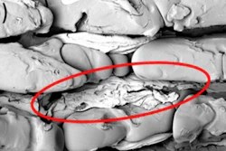 Aluminum in the trenches of the molded polymer surface after tensile shear test.