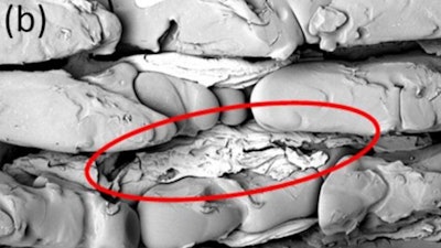 Aluminum in the trenches of the molded polymer surface after tensile shear test.