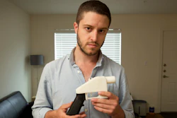 In this May 10, 2013, file photo, Cody Wilson, the founder of Defense Distributed, shows a plastic handgun made on a 3D-printer at his home in Austin, Texas.