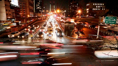 In this Jan. 11, 2018, file photo, cars pass the Queensboro Bridge in New York.