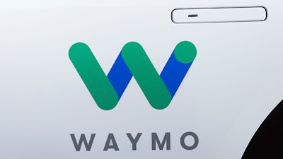This March 27, 2018, file photo shows the Waymo logo on the of a Jaguar I-Pace vehicle, in New York.