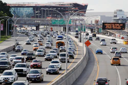 Cars on the Grand Central Parkway pass LaGuardia Airport in New York.