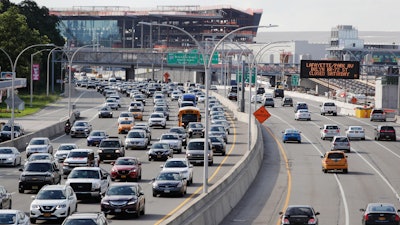 Cars on the Grand Central Parkway pass LaGuardia Airport in New York.