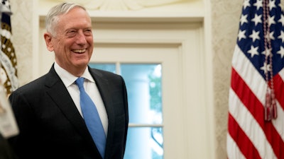 In this July 30, 2018, file photo, Defense Secretary Jim Mattis attends a swearing in ceremony for Robert Wilkie as Secretary of the Department of Veterans Affairs in the Oval Office of the White House in Washington.