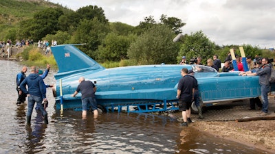 The restored Bluebird K7, which crashed killing pilot Donald Campbell in 1967, takes to the water for the first time in more than 50 years off the Isle of Bute on the west coast of Scotland.