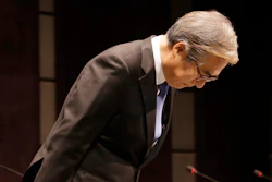 BMW Korea Chairman Kim Hyo-joon bows during a press conference in Seoul, South Korea, Monday, Aug. 6, 2018.