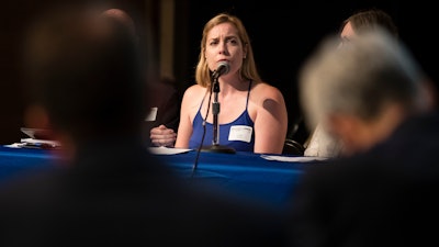 In this July 25, 2018 photo Lauren Woehr speaks during public comment period at the PFAS Community Stakeholder Meeting, on in Horsham, Pa.