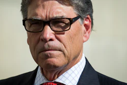 In this July 26, 2018 file photo, Secretary of Energy Rick Perry speaks with reporters at Dominion Energy's Cove Point LNG liquefaction Project facility in Lusby, Md.
