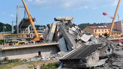 A view of the collapsed Morandi highway bridge, in Genoa, Italy, Sunday, Aug. 19, 2018.