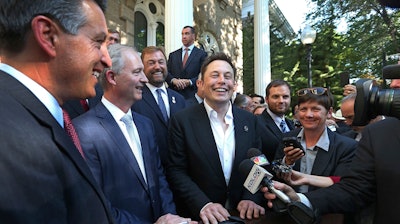 In this Sept. 4, 2014, file photo, Nevada Gov. Brian Sandoval, from left, executive director of the Governor's office of economic development Steve Hill and Tesla Motors CEO Elon Musk answer questions following a news conference at the Capitol in Carson City, Nev.