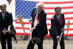 In this June 28, 2018, file photo, President Donald Trump, center, along with Wisconsin Gov. Scott Walker, left, and Foxconn Chairman Terry Gou participate in a groundbreaking event for the new Foxconn facility in Mt. Pleasant, Wis.