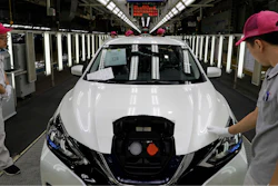 Chinese workers inspect a Nissan Sylphy Zero Emission, Nissan's first all-electric vehicle built in China, at a production line in Guangzhou, Guangdong province, China, Monday, Aug. 27, 2018.
