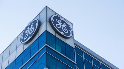 In this Jan. 16, 2018 photo, the General Electric logo is displayed at the top of their Global Operations Center.