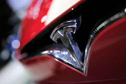 This Sept. 30, 2016, file photo shows the logo of the Tesla Model S on display at the Paris Auto Show in Paris.