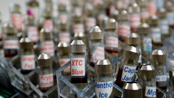 This Dec. 4, 2013 file photo shows vials of flavored liquid at a store selling electronic cigarettes and related items in Los Angeles.