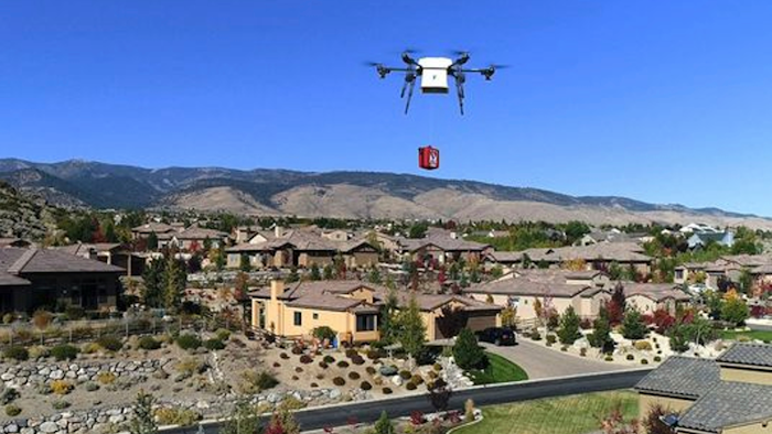 In this Oct. 2017 photo, a Flirtey delivery drone demonstrates the delivery of a defibrillator for cardiac arrest patients in Reno.