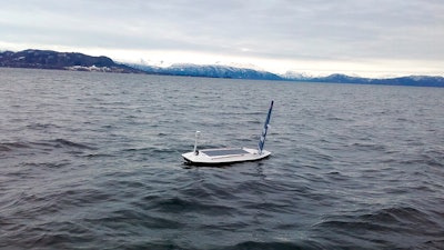 In this photo taken on March 14, 2018 and provided by Offshore Sensing, an autonomous Sailbuoy operated by Norwegian company Offshore Sensing performs a demonstration in the waters of Bjornafjorden, near Bergen, Norway.