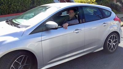 This 2017 photo shows Canvas' first subscriber, James O'Connor, sitting in his car from Canvas.