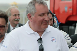 In this file photo dated Wednesday, June 6, 2018, Roscosmos state space corporation head Dmitry Rogozin, accompanies new International Space Station crew members, to the rocket prior the launch at the Russian leased Baikonur cosmodrome, Kazakhstan.