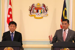 Malaysia's Minister of Economic Affair Mohamed Azmin Ali, right, and Minister for Infrastructure and Minister for Transport of Singapore Khaw Boon Wan, left, speak during a press conference at Prime Minister Office in Putrajaya, Malaysia, Wednesday, Sept. 5, 2018.