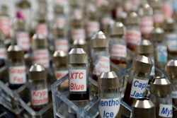 This Dec. 4, 2013 file photo shows vials of flavored liquid at a store selling electronic cigarettes and related items in Los Angeles.