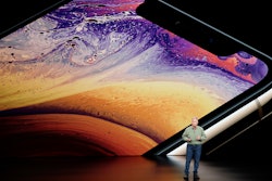 Phil Schiller, Apple's senior vice president of worldwide marketing, speaks about the Apple iPhone XS at the Steve Jobs Theater during an event to announce new Apple products Wednesday, Sept. 12, 2018, in Cupertino, Calif.