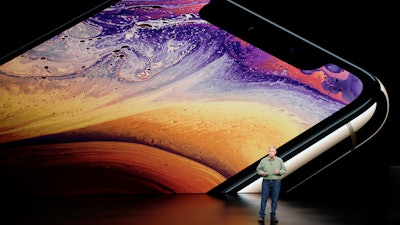 Phil Schiller, Apple's senior vice president of worldwide marketing, speaks about the Apple iPhone XS at the Steve Jobs Theater during an event to announce new Apple products Wednesday, Sept. 12, 2018, in Cupertino, Calif.