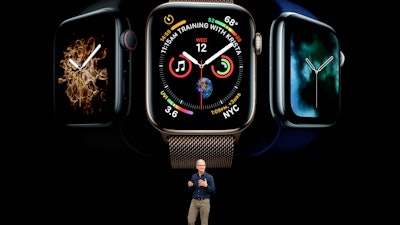 Apple CEO Tim Cook discusses the new Apple Watch 4 at the Steve Jobs Theater during an event to announce new products Wednesday, Sept. 12, 2018, in Cupertino, Calif.