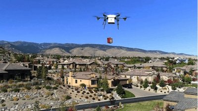 In this Oct. 2017 photo, a Flirtey delivery drone demonstrates the delivery of a defibrillator for cardiac arrest patients in Reno.