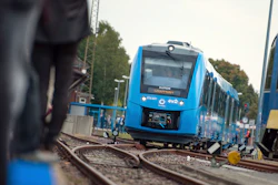 In this Sept. 16, 2018 photo a fuel cell train which is powered by hydrogen arrives in Bremervoerde, northern Germany. It is one of two trains that will go into regular service in 2019.