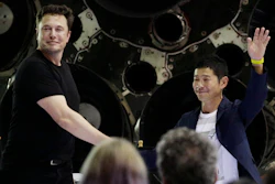 SpaceX founder and chief executive Elon Musk, left, shakes hands with Japanese billionaire Yusaku Maezawa, right, after announcing him as the first private passenger on a trip around the moon, Monday, Sept. 17, 2018, in Hawthorne, Calif.