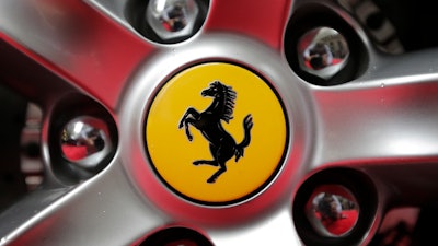 This Monday, Oct. 9, 2017 file photo shows a Ferrari logo on a car outside the New York Stock Exchange in New York.