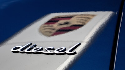 In this Wednesday, Nov. 4, 2015 photo the word 'Diesel' and the logo of the German car manufacturer Porsche is pictured in Stuttgart, Germany.