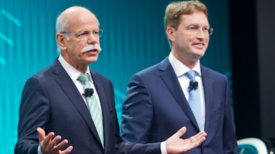 In this Jan. 13, 2014 file photo Mercedes-Benz marketing chief Ola Kallenius, right, stand with Daimler Chairman Dieter Zetsche at the end of a press conference at the North American International Auto Show in Detroit, Mich.