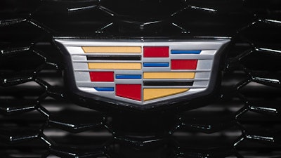 In this March 27, 2018, file photo the Cadillac emblem is shown on the from grill of its XT4 at the New York Auto Show.