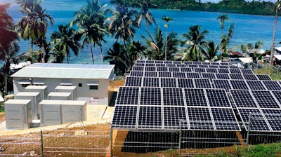 This undated product image provided by NantEnergy shows zinc-air batteries in cabinets at left in a village in Papua, Indonesia.