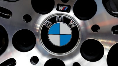 The logo of German car manufacturer BMW is photographed at a BMW M6 Coupe car during the earnings press conference in Munich, Germany, Tuesday, March 21, 2017.