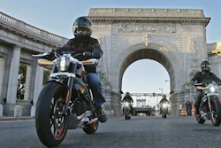 In this photo provided by Harley-Davidson, riders introduce Project LiveWire — the first electric Harley-Davidson motorcycle — as they cross the Manhattan Bridge in New York, Monday, June 23, 2014.