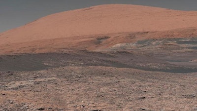 This image provided by NASA, assembled from a series of January 2018 photos made by the Mars Curiosity rover, shows an uphill view of Mount Sharp, which Curiosity has been climbing.