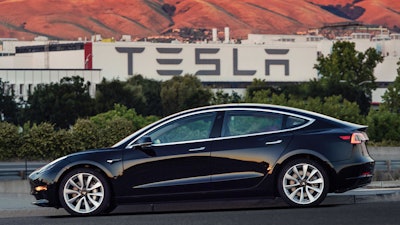 This undated image provided by Tesla Motors shows the Tesla Model 3 sedan.