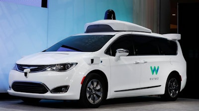 A Chrysler Pacifica hybrid outfitted with Waymo's suite of sensors and radar.