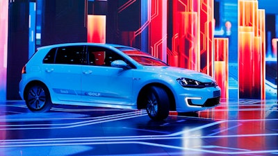 In this Jan. 5, 2016 file photo Volkswagen unveils the e-Golf Touch electric car during a keynote address at CES International in Las Vegas.