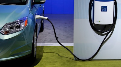 A charging station is displayed at the LA Auto Show in Los Angeles.