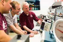 Engineering technology students work with College of Engineering Assistant Professor Rolfe Sassenfeld on equipment, May 15, 2015.