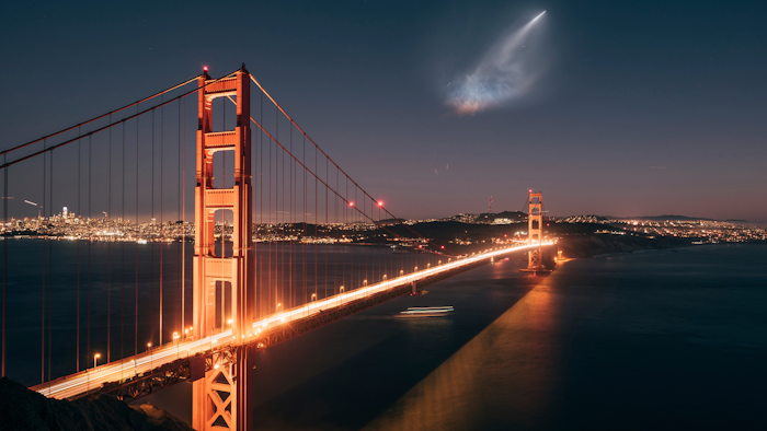 In this photo taken Sunday, Oct. 7, 2018 and provided by Justin Borja, a SpaceX Falcon 9 rocket launch is seen in the distance over the Golden Gate Bridge near Sausalito, Calif.