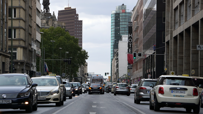 In this Tuesday, Aug. 28, 2018 photo cars drive on the 'Leipziger Strasse' towards the Potsdamer Platz in Berlin, Germany.