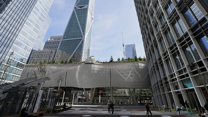 In this Sept. 27, 2018, file photo, a few people walk through main plaza entryway to the closed Salesforce Transit Center in San Francisco.